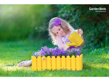 Start a raised vegetable garden bed with your child